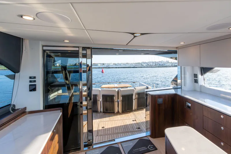 Slide: The Image of Luxurious interior of 2026 Fairline Squadron 58 yacht with ocean view. - 16
