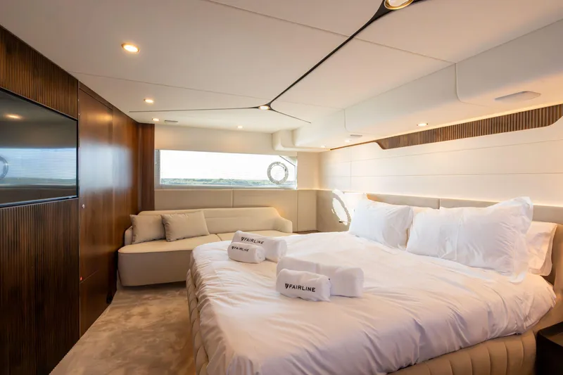 Slide: The Image of Luxurious bedroom interior of 2026 Fairline Squadron 58 yacht with elegant furnishings. - 21