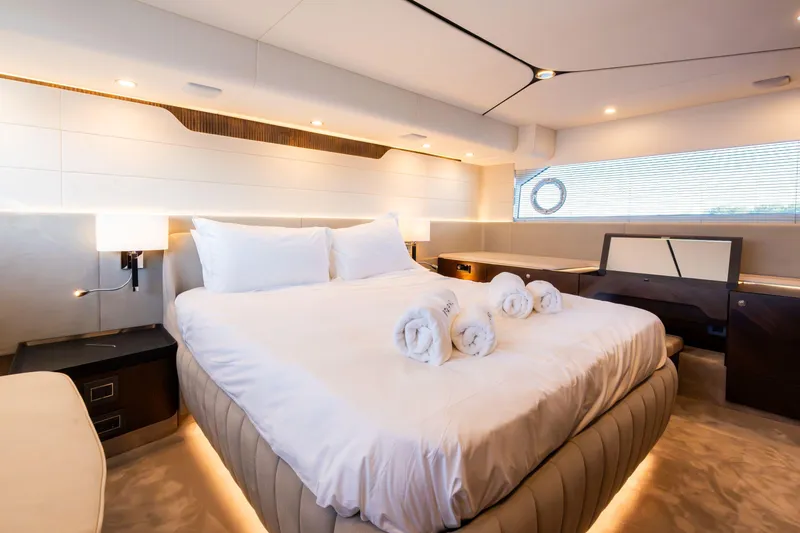 Slide: The Image of Luxurious bedroom interior on 2026 Fairline Squadron 58 yacht, featuring elegant design and ambient lighting. - 25