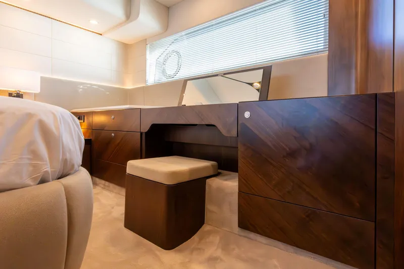 Slide: The Image of Luxurious interior of 2026 Fairline Squadron 58 yacht with elegant wood finish and seating. - 26