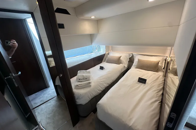 Slide: The Image of Luxurious twin cabin interior of 2026 Fairline Squadron 58 yacht with elegant bedding. - 28