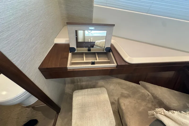 Slide: The Image of Luxurious bedroom interior of 2026 Fairline Squadron 58 yacht, featuring elegant wood finishes. - 35