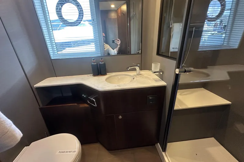 Slide: The Image of Luxurious bathroom in 2026 Fairline Squadron 58 yacht with modern fixtures and elegant design. - 36