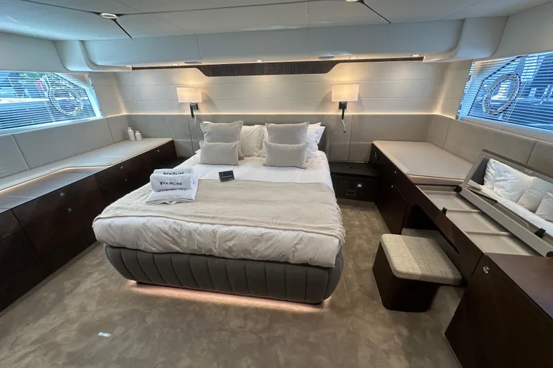 Slide: The Image of Luxurious bedroom interior of 2026 Fairline Squadron 58 yacht, featuring elegant design and plush bedding. - 38