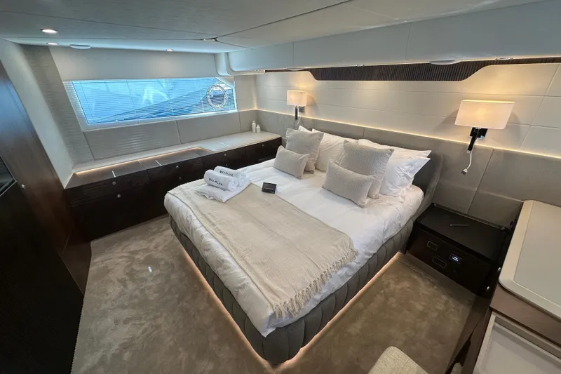 Slide: The Image of Luxurious bedroom interior on 2026 Fairline Squadron 58 yacht, featuring elegant bedding and modern design. - 43
