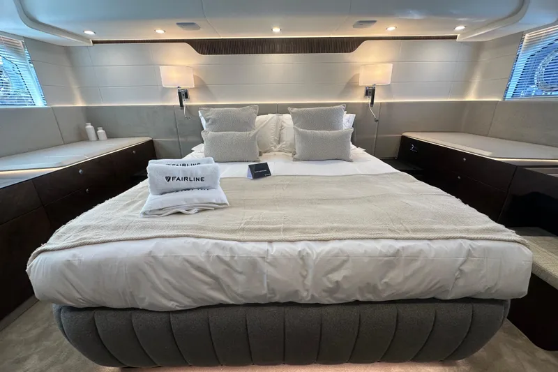 Slide: The Image of Interior view of 2026 Fairline Squadron 58 yacht, featuring modern design and elegant staircase. - 46