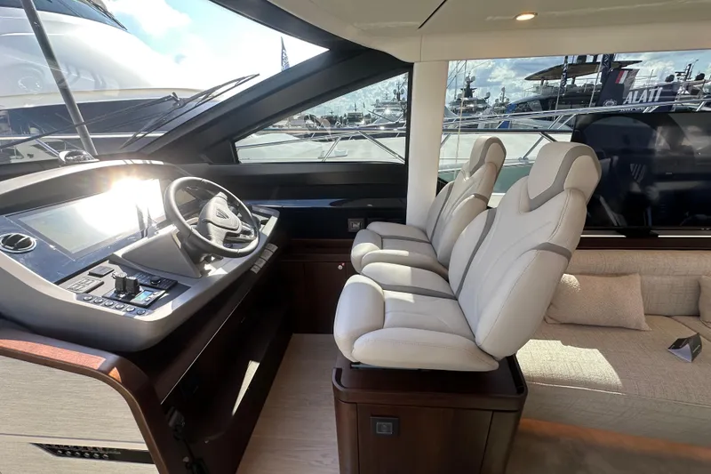 Slide: The Image of Flybridge view of 2026 Fairline Squadron 58 yacht at a boat show. - 53