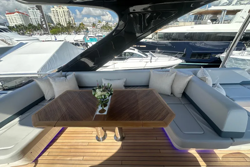Slide: The Image of Luxurious seating area on 2026 Fairline Squadron 58 yacht, featuring plush cushions and sleek design. - 58
