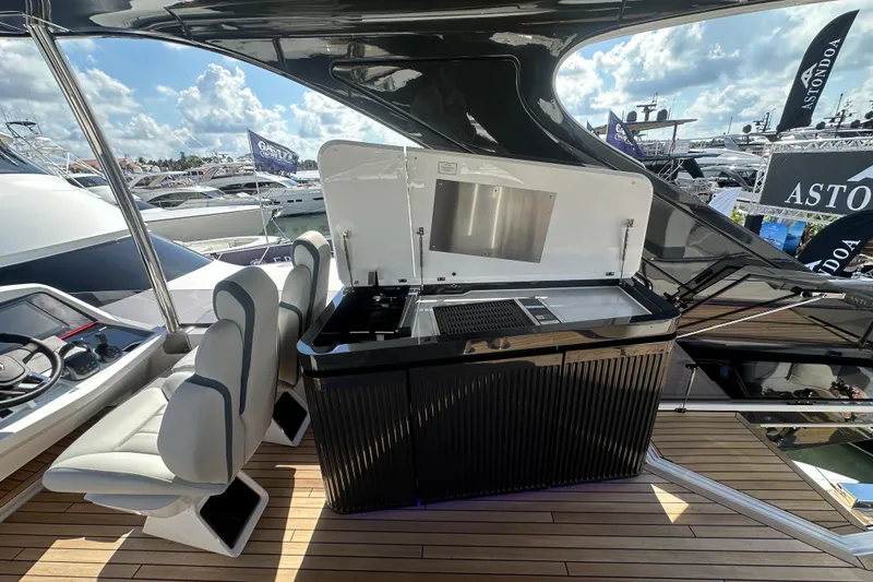 Slide: The Image of Luxury Fairline Squadron 58 yacht deck, 2026 model, with elegant wooden finish and dockside view. - 61