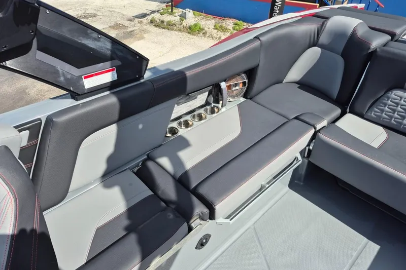 Slide: The Image of 2022 MasterCraft X24 boat interior with sleek seating and modern design. - 10