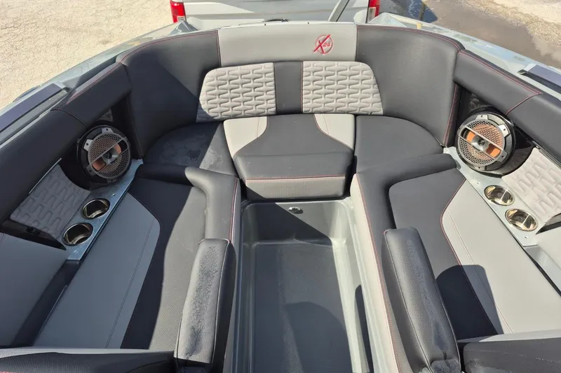 Slide: The Image of 2022 MasterCraft X24 boat interior with premium seating and built-in speakers. - 15