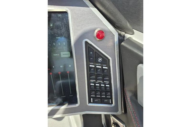 Slide: The Image of Control panel of 2022 MasterCraft X24 boat with buttons and display screen. - 18