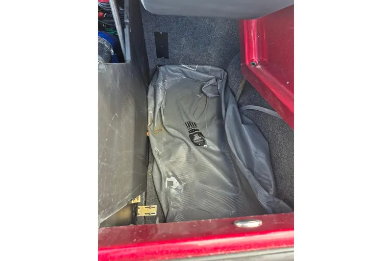 Slide: The Image of 2022 MasterCraft X24 storage compartment with gray bag inside. - 30