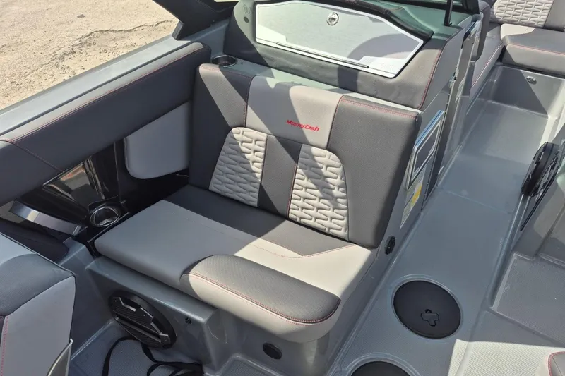 Slide: The Image of 2022 MasterCraft X24 boat interior with gray seating and modern design. - 34