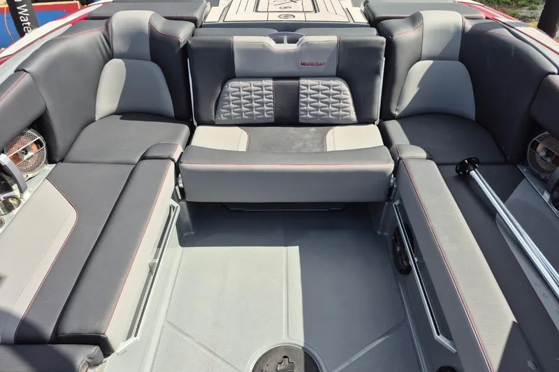 Slide: The Image of 2022 MasterCraft X24 boat interior with gray seating and modern design. - 9