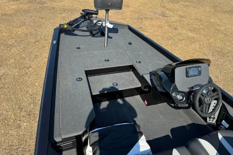 Slide: The Image of 2026 Vexus Defender 181 boat interior with steering console and seating. - 11