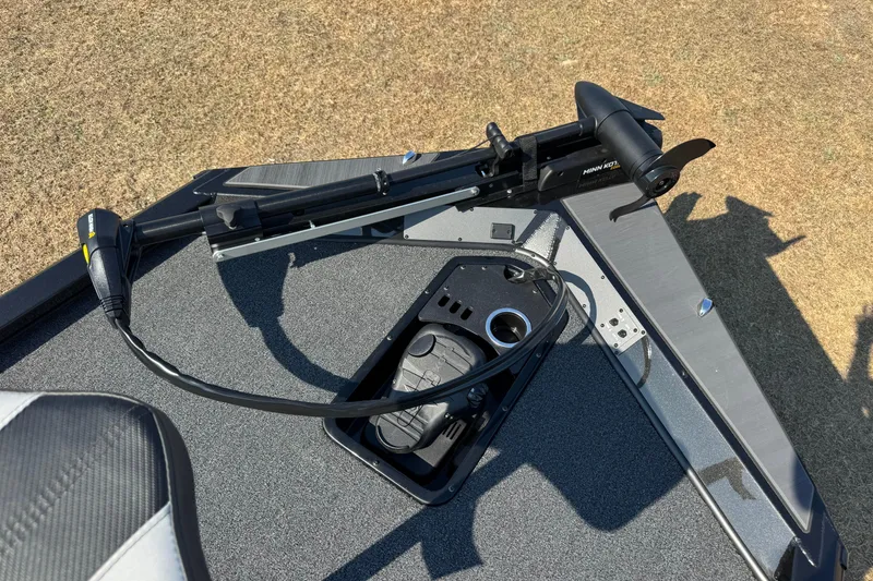 Slide: The Image of 2026 Vexus Defender 181 boat deck with Minn Kota trolling motor and foot pedal. - 17