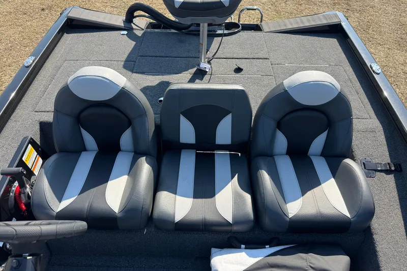 Slide: The Image of 2026 Vexus Defender 181 boat interior with three gray and white cushioned seats. - 20