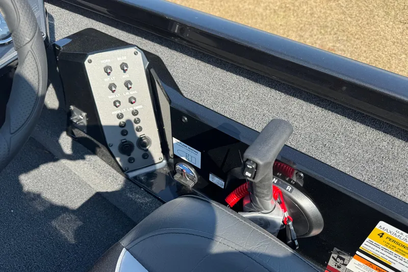 Slide: The Image of 2026 Vexus Defender 181 boat control panel with steering wheel and throttle lever. - 23