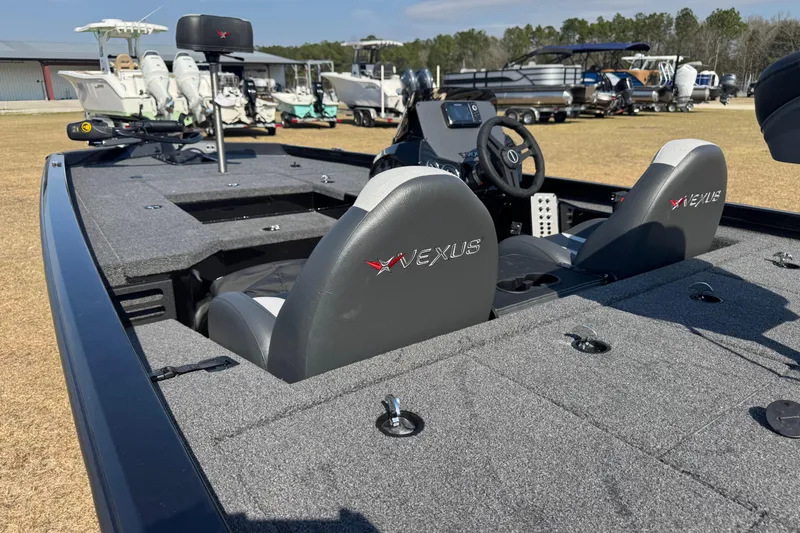 Slide: The Image of 2026 Vexus Defender 181 boat interior with gray seating and control panel. - 29