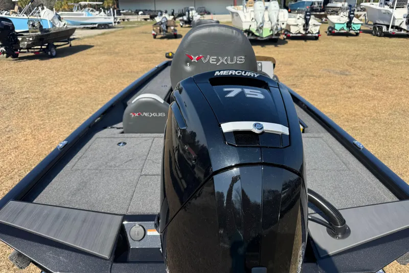 Slide: The Image of 2026 Vexus Defender 181 boat with Mercury 75 engine, displayed outdoors. - 4
