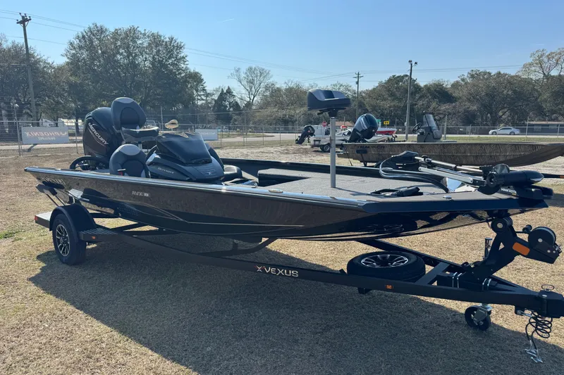 Slide: The Image of 2026 Vexus Defender 181 boat on trailer, parked outdoors, featuring sleek design and modern equipment. - 8