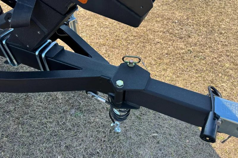 Slide: The Image of Trailer hitch of 2026 Vexus Defender 181 on grass background. - 9