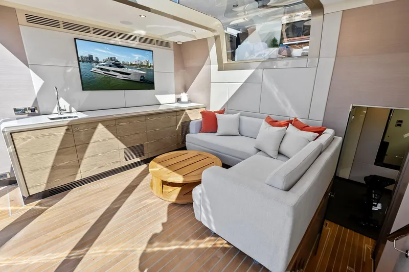 Slide: The Image of Luxurious interior of 2024 Ocean Alexander 35 Revolution yacht with modern seating and entertainment area. - 24