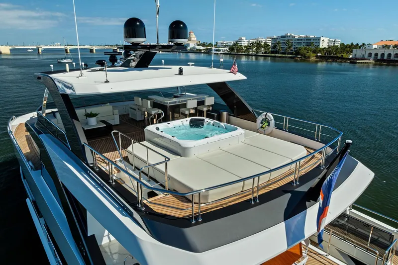 Slide: The Image of Luxurious 2024 Ocean Alexander 35 Revolution yacht with jacuzzi on deck, docked in scenic marina. - 4