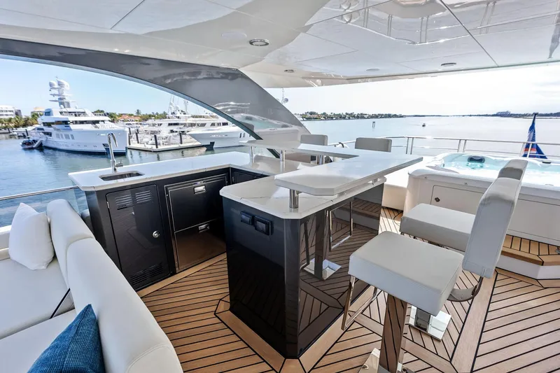Slide: The Image of Luxurious 2024 Ocean Alexander 35 Revolution yacht deck with bar and seating area. - 14
