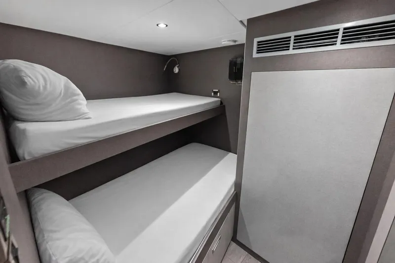 Slide: The Image of 2024 Ocean Alexander 35 Revolution yacht cabin with bunk beds and modern design. - 63