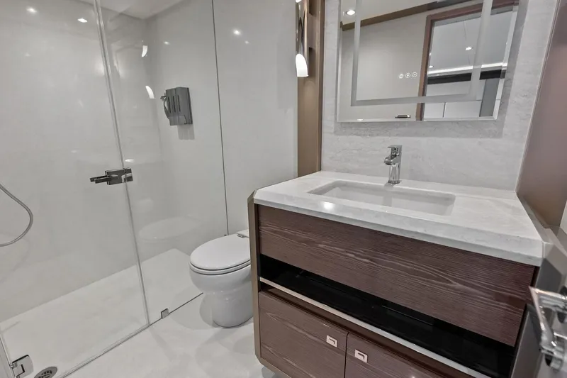Slide: The Image of Luxurious bathroom in 2024 Ocean Alexander 35 Revolution yacht, featuring modern fixtures and elegant design. - 55