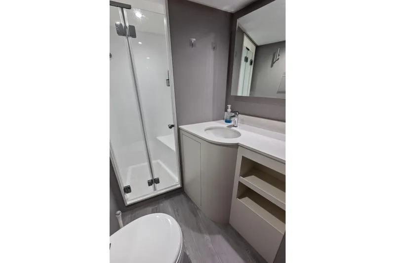 Slide: The Image of Modern bathroom in 2024 Ocean Alexander 35 Revolution yacht, featuring shower and sleek vanity. - 62