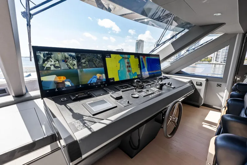 Slide: The Image of Modern helm station of 2024 Ocean Alexander 35 Revolution yacht with advanced navigation displays. - 28