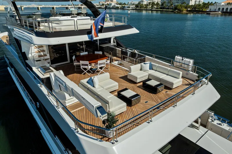 Slide: The Image of Luxurious 2024 Ocean Alexander 35 Revolution yacht with spacious deck and elegant seating area. - 5