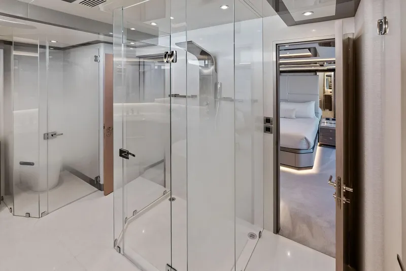 Slide: The Image of Luxurious interior of 2024 Ocean Alexander 35 Revolution yacht, featuring modern glass shower and elegant bedroom. - 49