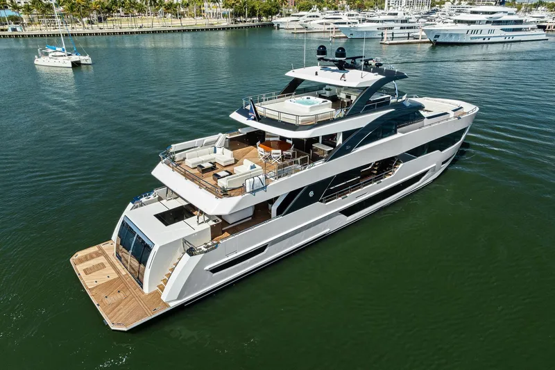 Slide: The Image of Luxury 2024 Ocean Alexander 35 Revolution yacht on serene water, showcasing elegant design. - 2