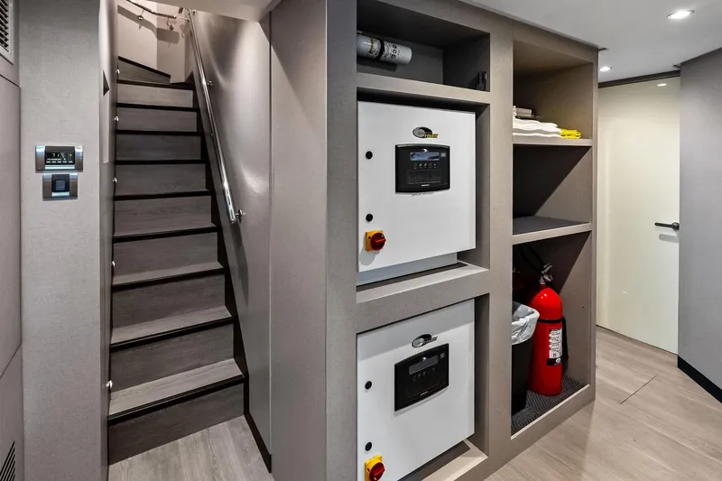 Slide: The Image of Interior of 2024 Ocean Alexander 35 Revolution yacht, featuring stairs and control panels. - 58