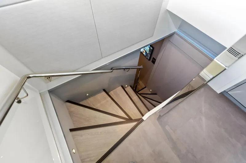 Slide: The Image of Staircase inside 2024 Ocean Alexander 35 Revolution yacht, featuring sleek modern design. - 26