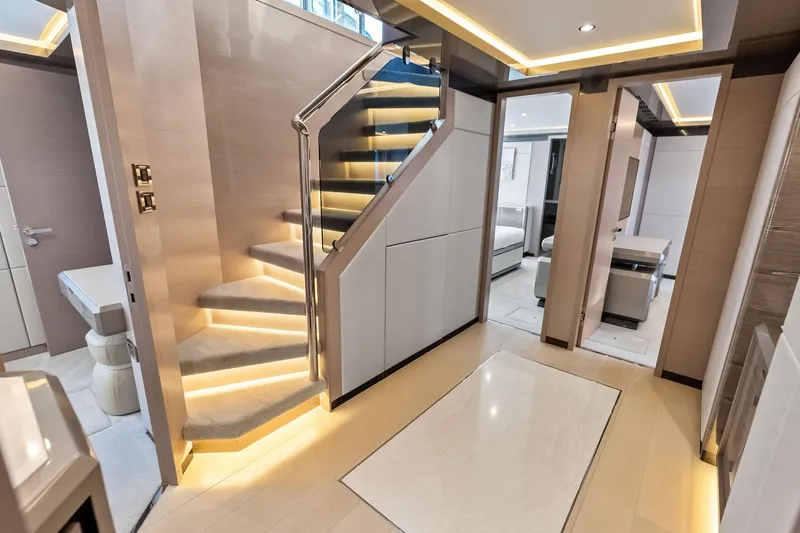 Slide: The Image of Luxurious interior of 2024 Ocean Alexander 35 Revolution yacht with modern staircase and elegant design. - 41