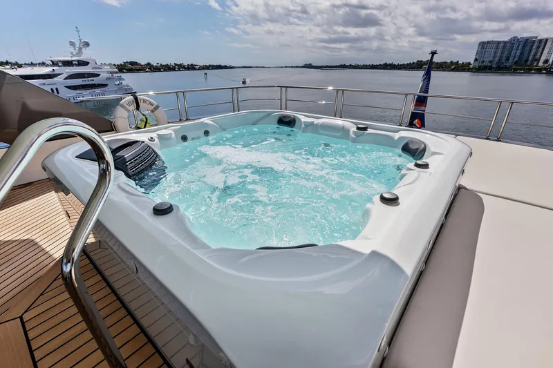 Slide: The Image of Luxurious hot tub on 2024 Ocean Alexander 35 Revolution yacht, overlooking serene waters. - 9
