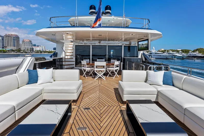 Slide: The Image of Luxurious 2024 Ocean Alexander 35 Revolution yacht deck with elegant seating and scenic waterfront views. - 16