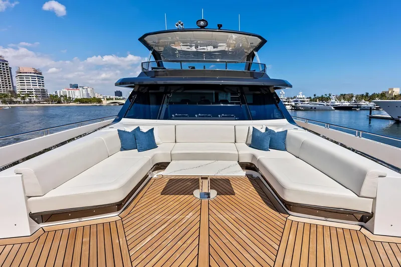 Slide: The Image of Luxurious 2024 Ocean Alexander 35 Revolution yacht with spacious deck seating and scenic marina view. - 17