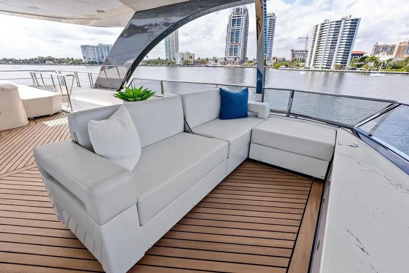 Slide: The Image of Luxurious seating on 2024 Ocean Alexander 35 Revolution yacht, with waterfront cityscape view. - 22