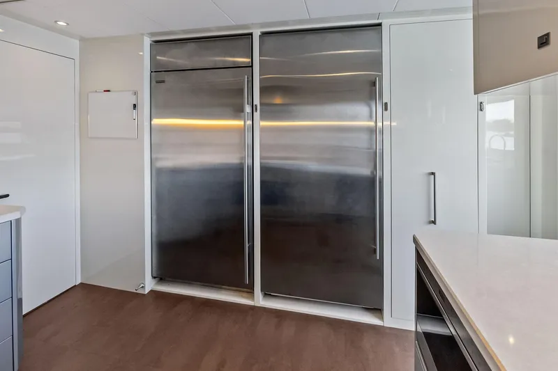 Slide: The Image of Modern kitchen interior on 2024 Ocean Alexander 35 Revolution yacht, featuring sleek stainless steel appliances. - 38