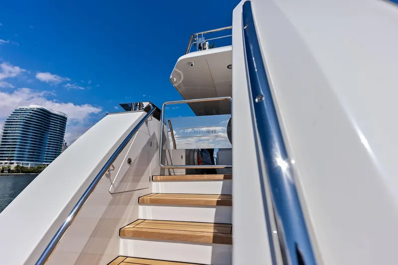 Slide: The Image of 2024 Ocean Alexander 35 Revolution yacht stairs with modern architecture in the background. - 15