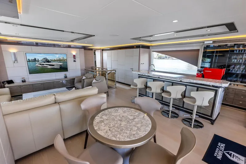 Slide: The Image of Luxurious interior of 2024 Ocean Alexander 35 Revolution yacht with modern seating and bar area. - 35