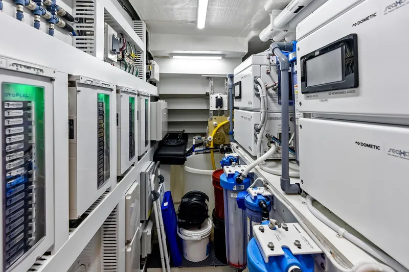 Slide: The Image of Engine room of 2024 Ocean Alexander 35 Revolution yacht, featuring advanced control systems. - 65