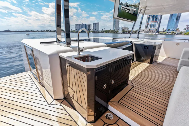 Slide: The Image of Luxurious 2024 Ocean Alexander 35 Revolution yacht deck with modern amenities and stunning waterfront view. - 11