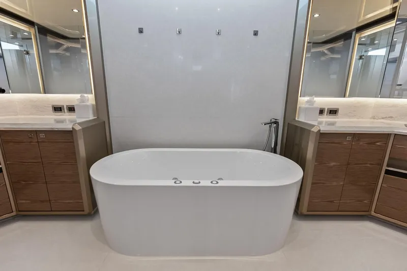 Slide: The Image of Luxurious bathroom in 2024 Ocean Alexander 35 Revolution yacht with modern bathtub and elegant design. - 47
